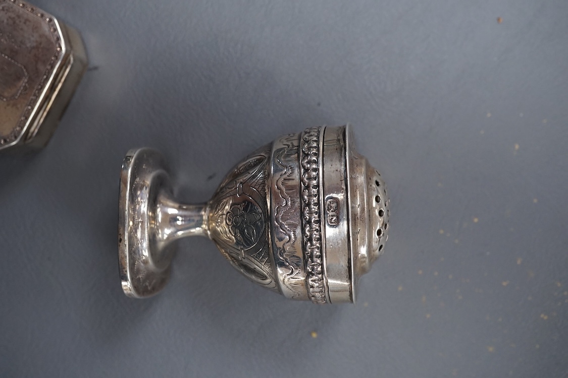 A George III silver octagonal nutmeg grater by Phipps & Robinson, London, 1810, 46mm(a.f.), together with a George III silver pedestal pepperette, by Alice & George Burroughs, London, 1808, 70mm.